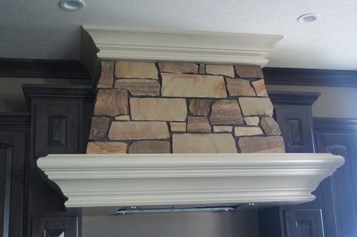 Custom stone stove hood surround - Custom residential stonework in Columbus, NE