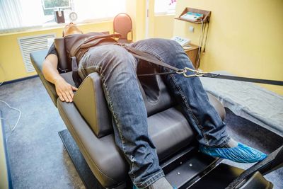 Man at Non-Surgical Spinal Decompression Procedure — Hawley, PA — Pocono Chiropractic Clinic Man at Non-Surgical Spinal Decompression Procedure — Hawley, PA — Pocono Chiropractic Clinic