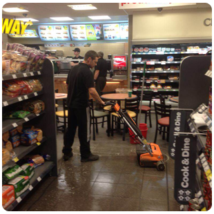 Professional cleaner with a large yellow vacuum cleaner, conveniently attached to his back
