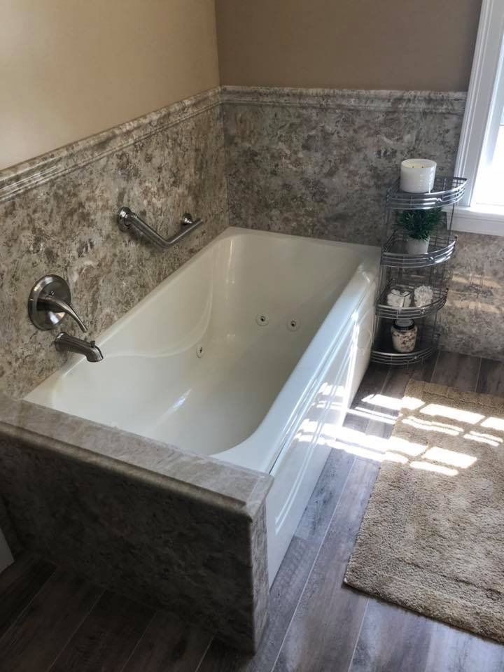 Bathtub with Jet Madeira Granite Wall Surround and Grab Bar