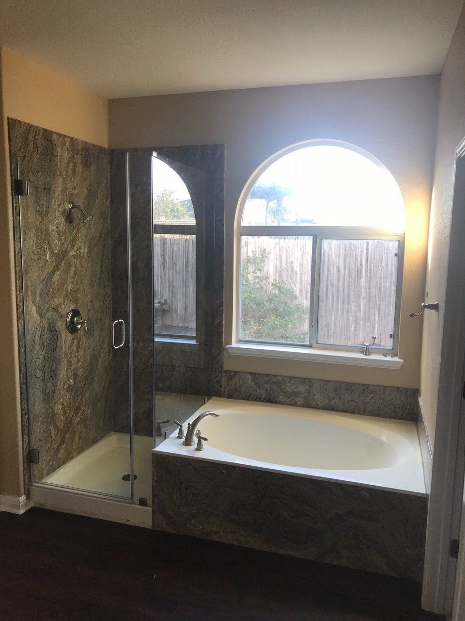 Japarana Granite Walk In Shower Wall Surround and White Tub