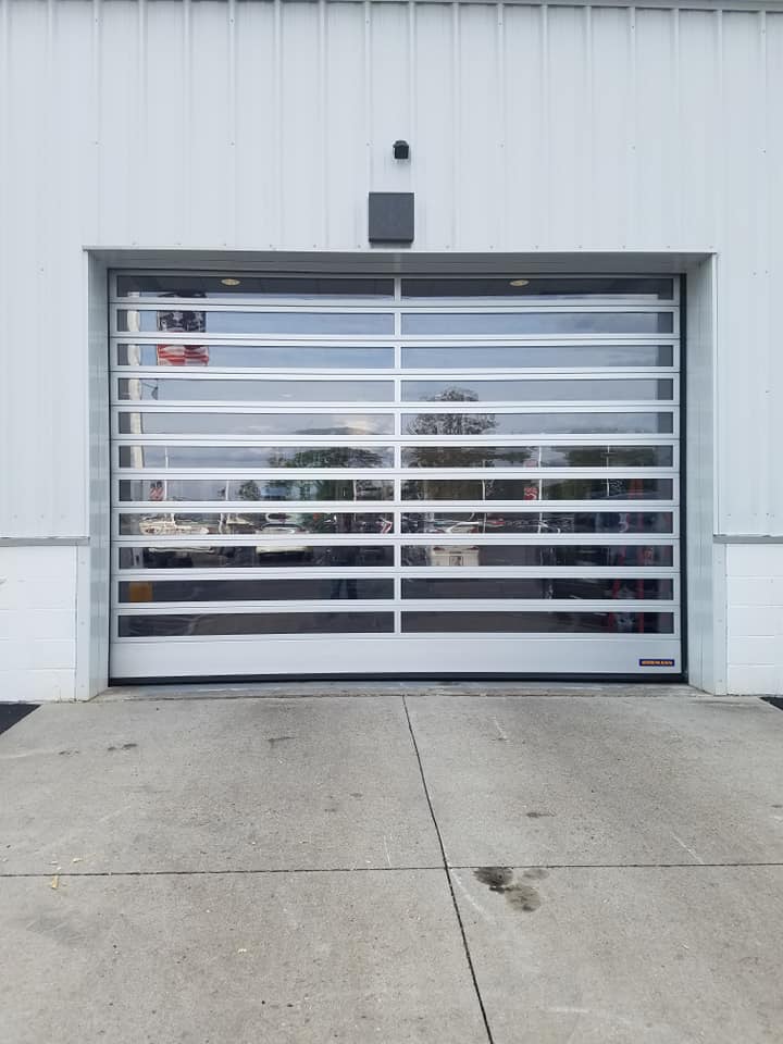 Wooden Car Garage ─ Columbus, IN ─ Sterling Garage Doors, Inc Glass Car Garage ─ Columbus, IN ─ Sterling Garage Doors, Inc