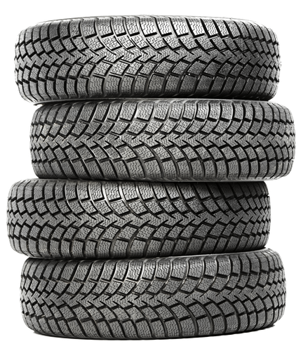 Four tires are stacked on top of each other on a white background.