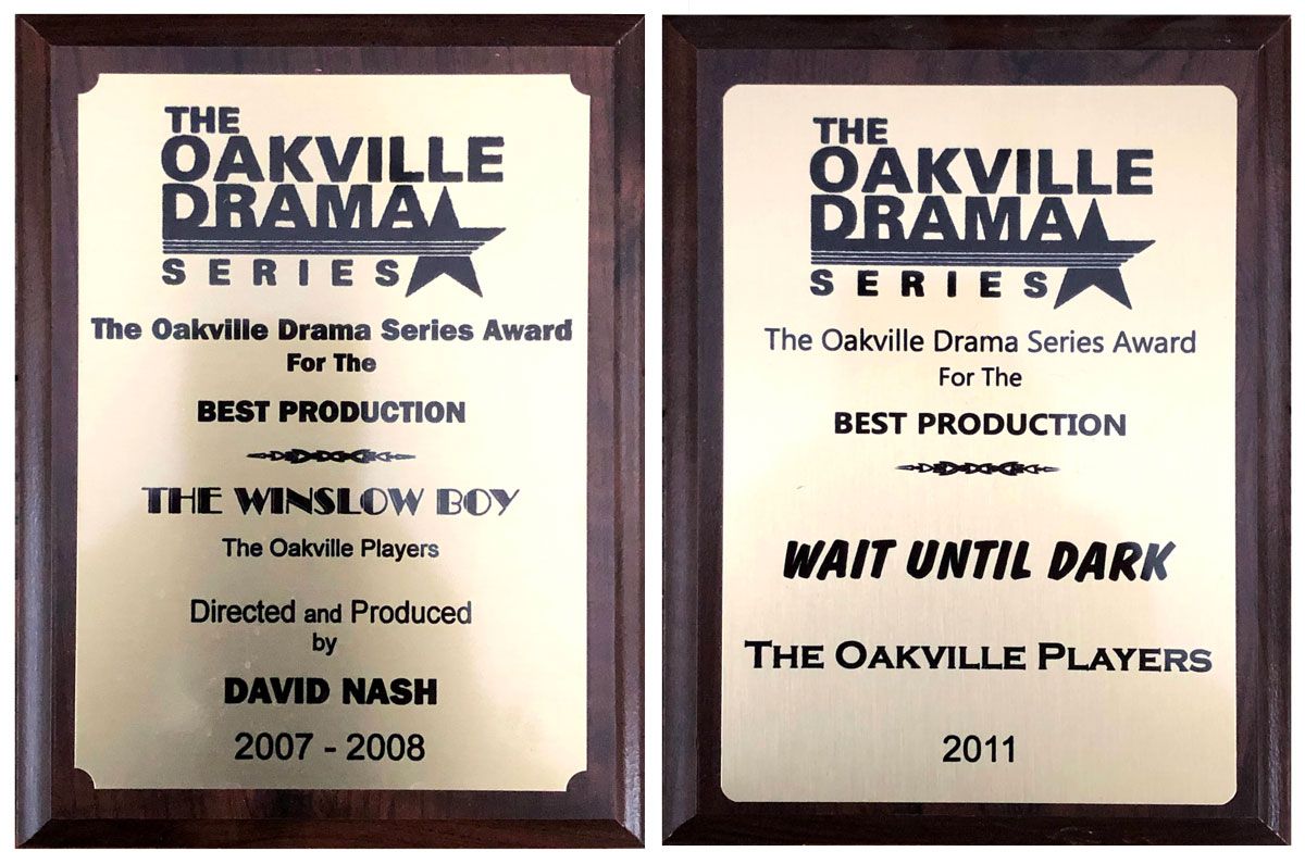 Two awards on wooden plaques for