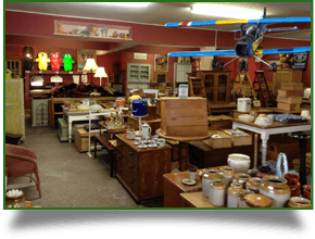 A collection of wooden antiques including a model plane