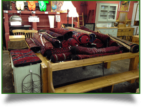 Antique rugs on a wooden table