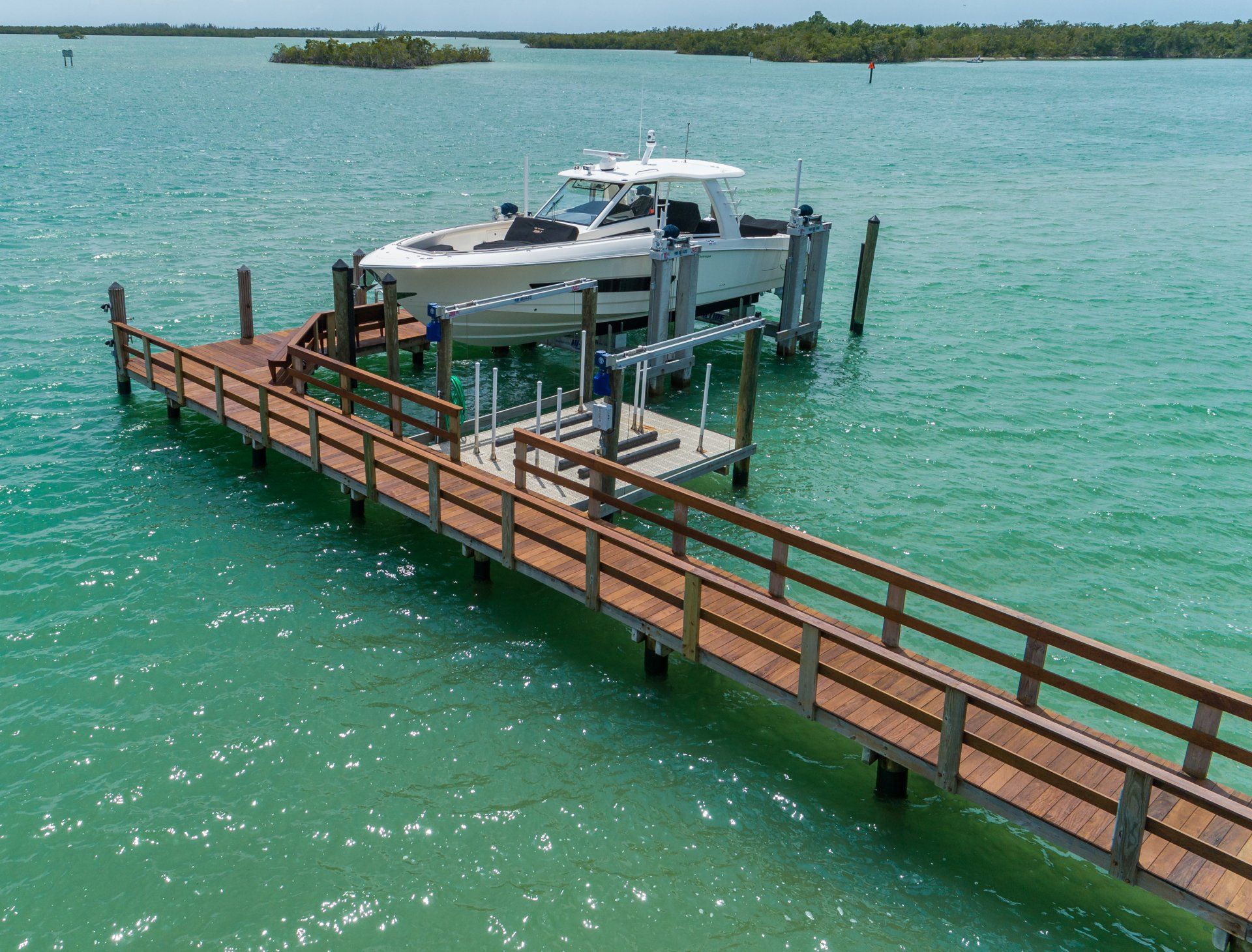 Lifted Boat — Marco Island, FL — Collier Seawall & Dock