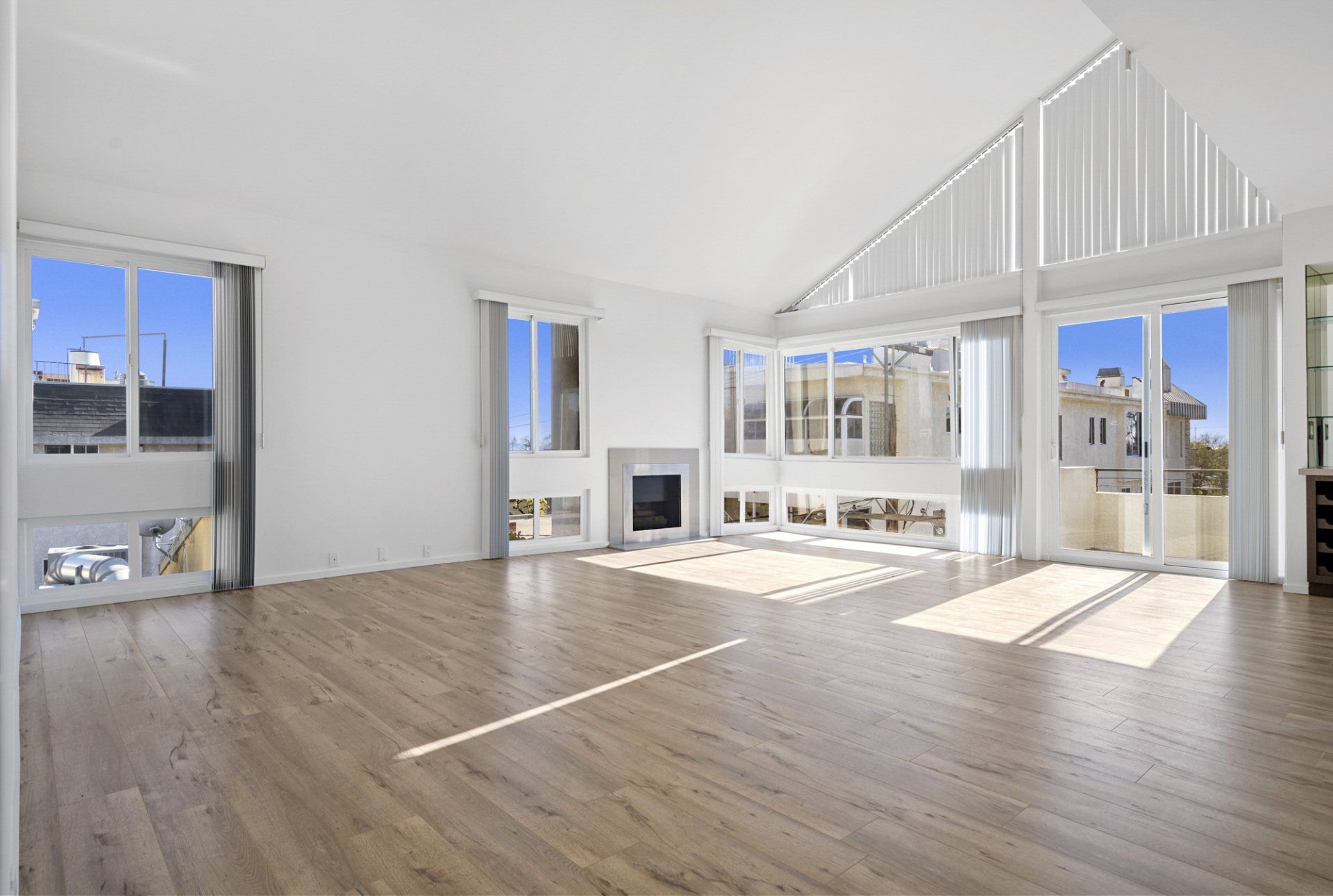 Interior view of empty living room with large vertical windows
