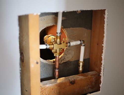 opened wall to repair shower fixture