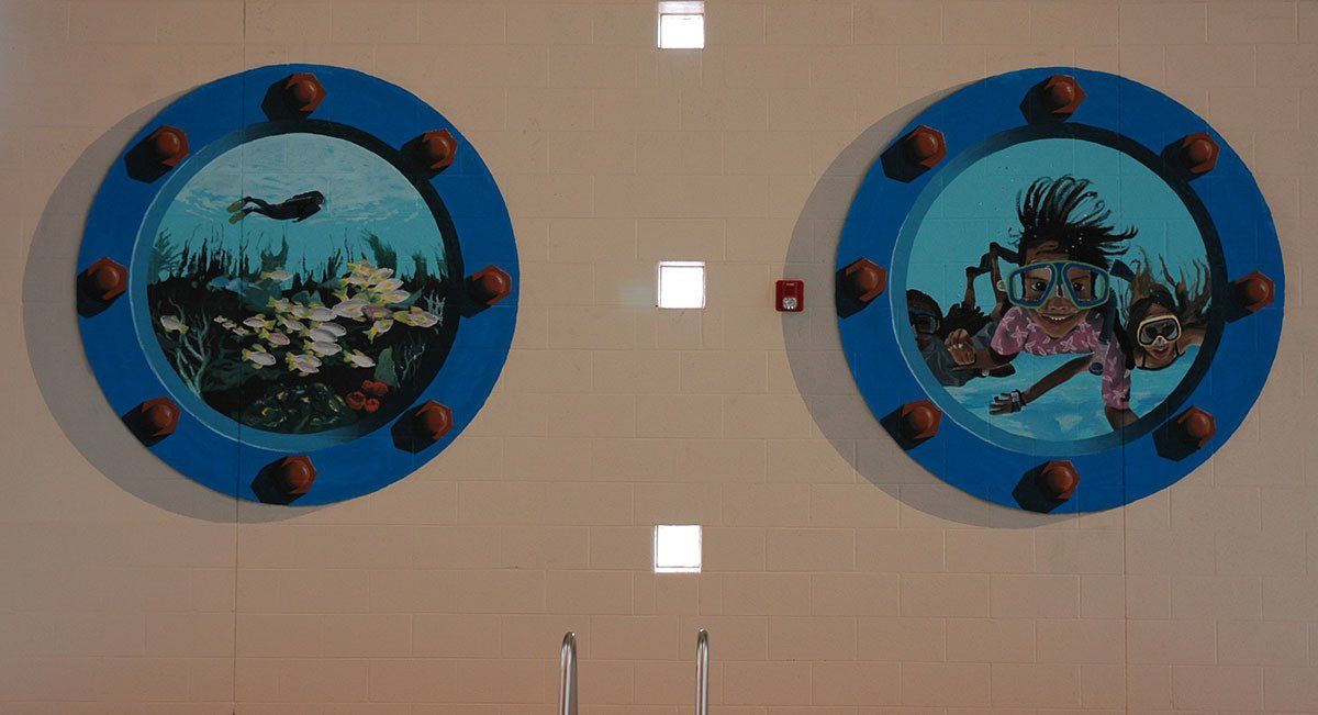Two paintings on a wall with a fire extinguisher
