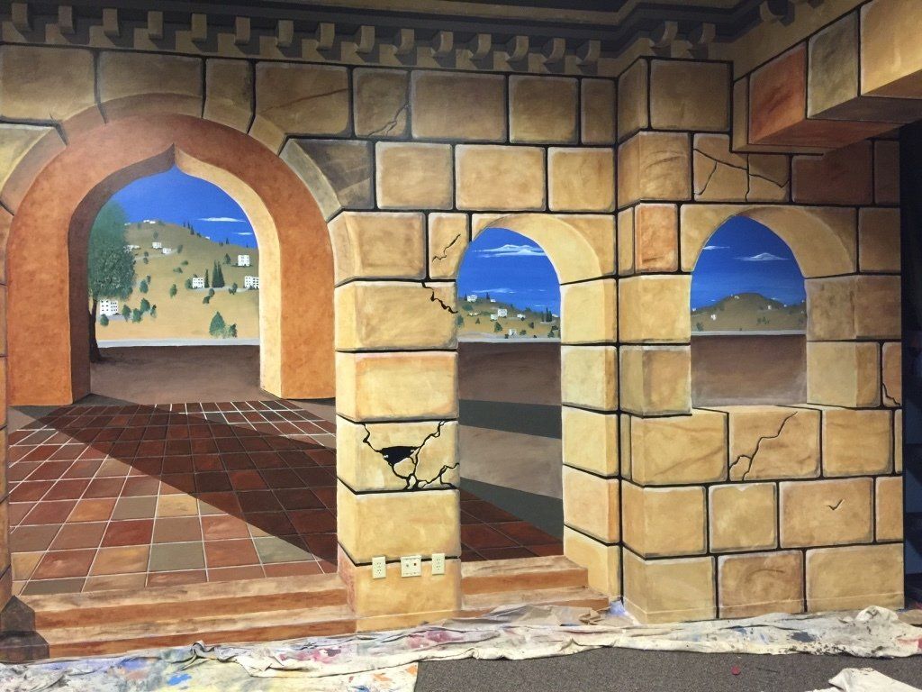 A painting of a brick wall with arches and stairs