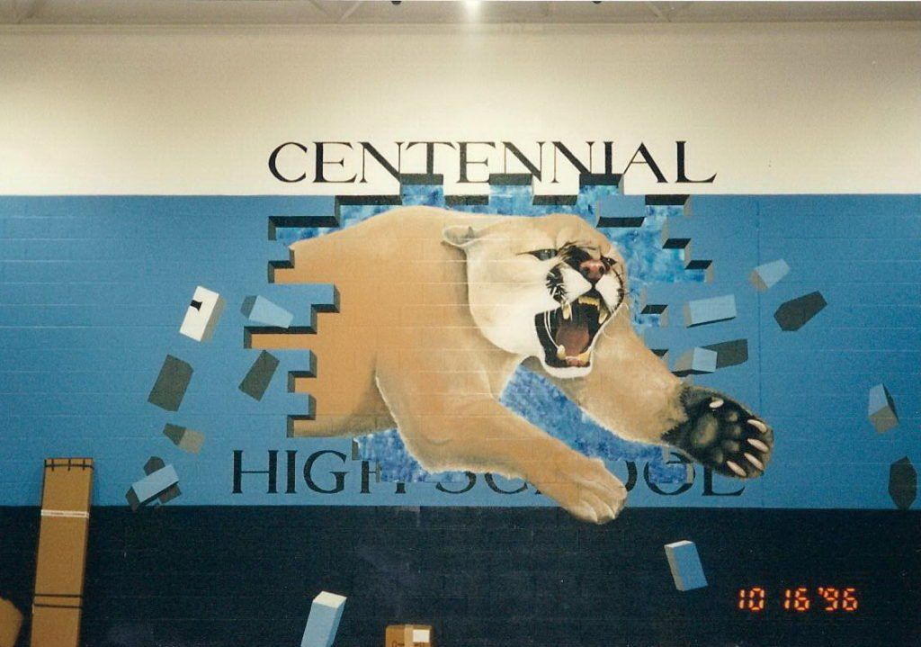 A centennial high school mural with a cougar on it