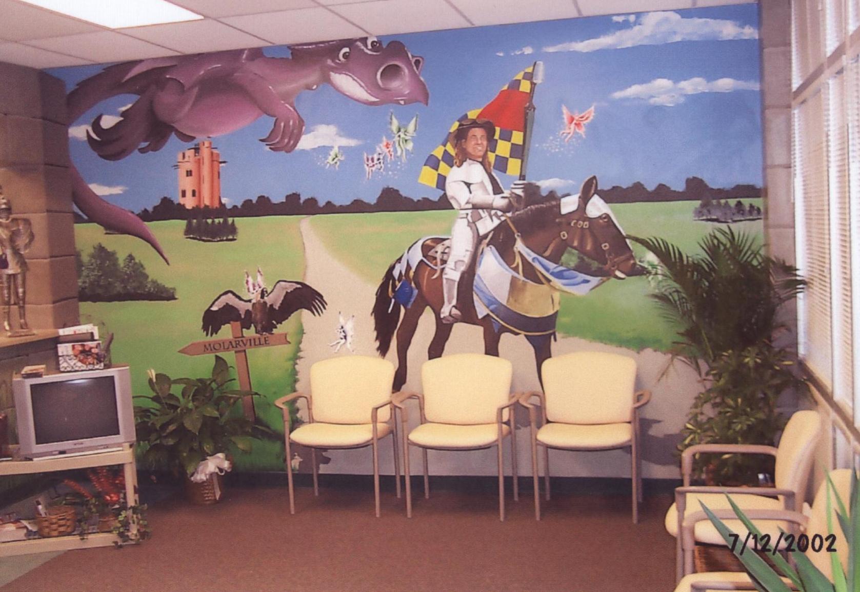 A waiting room with a painting of a man riding a horse