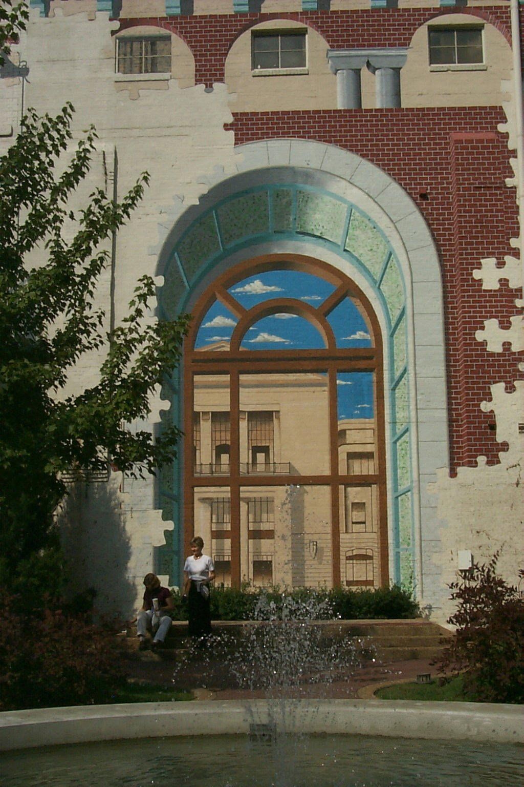 A building with a fountain in front of it