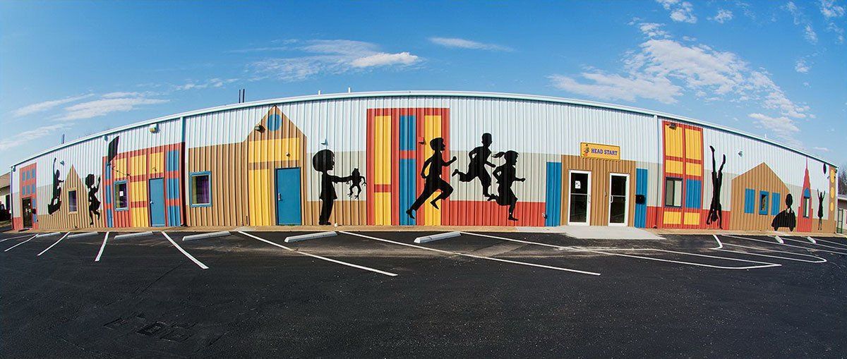 A large building with a mural on the side of it.