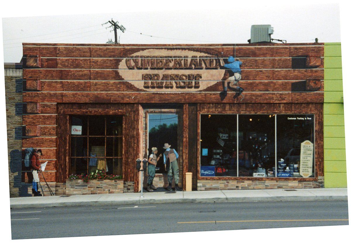 A brick building with a sign that says queensland