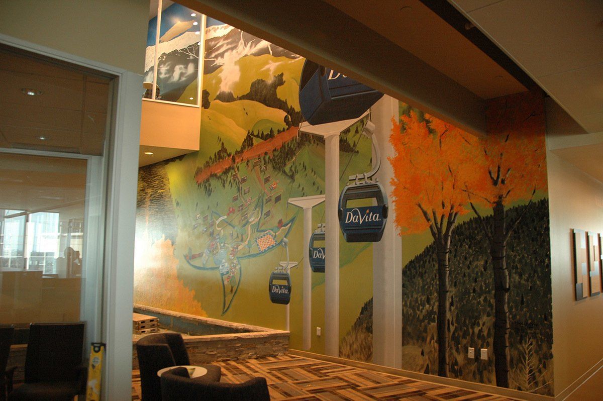A room with a painting of a ski lift on the wall