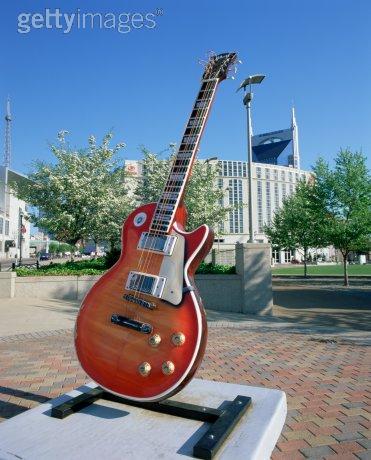 A statue of a guitar with the words gettyimages on the bottom