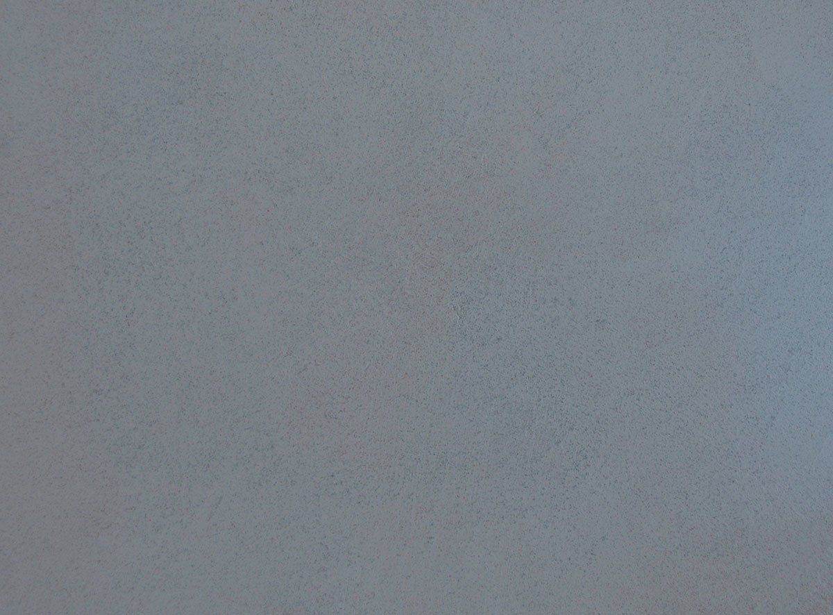 A close up of a gray paper texture.