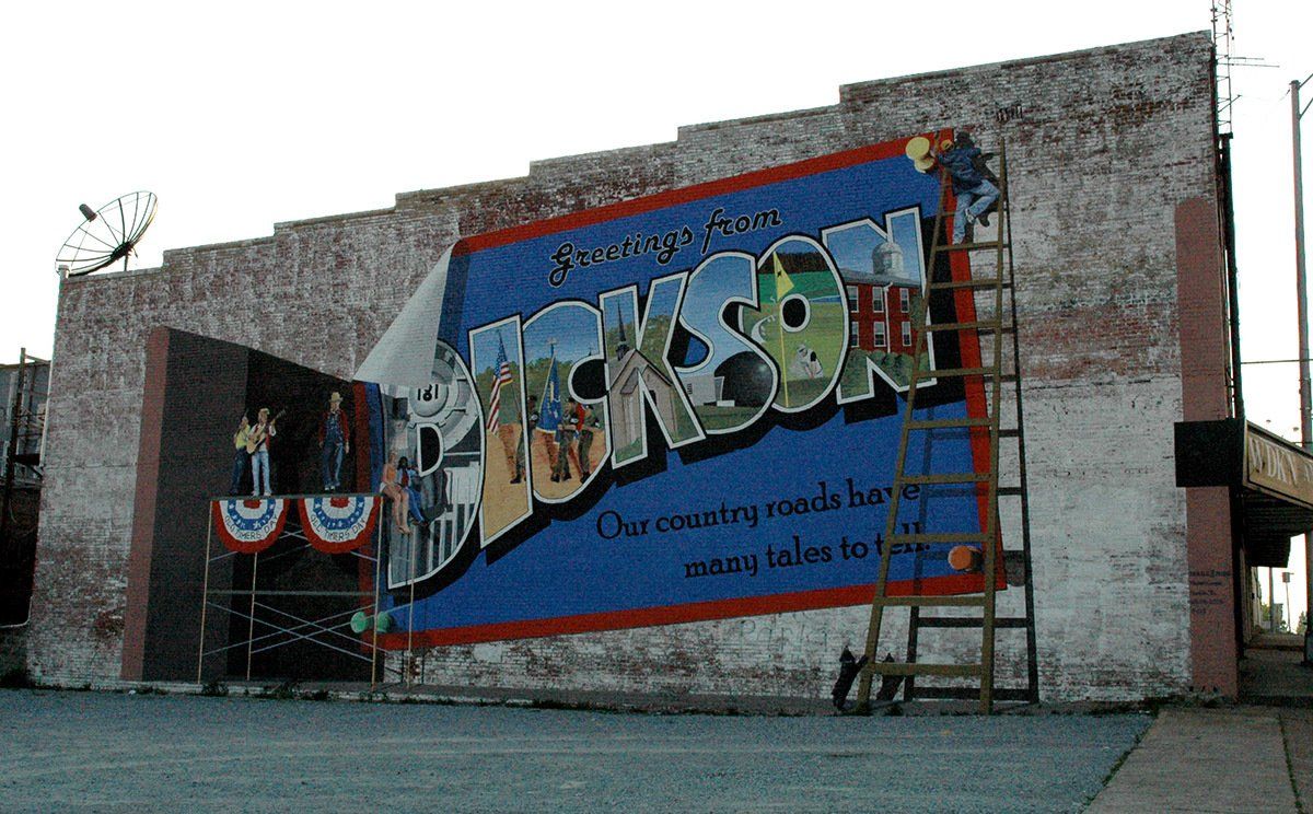 A large billboard on the side of a building that says jackson