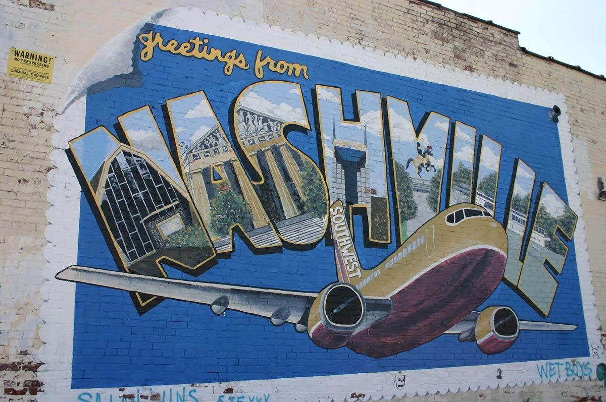 A mural on a wall that says greetings from nashville