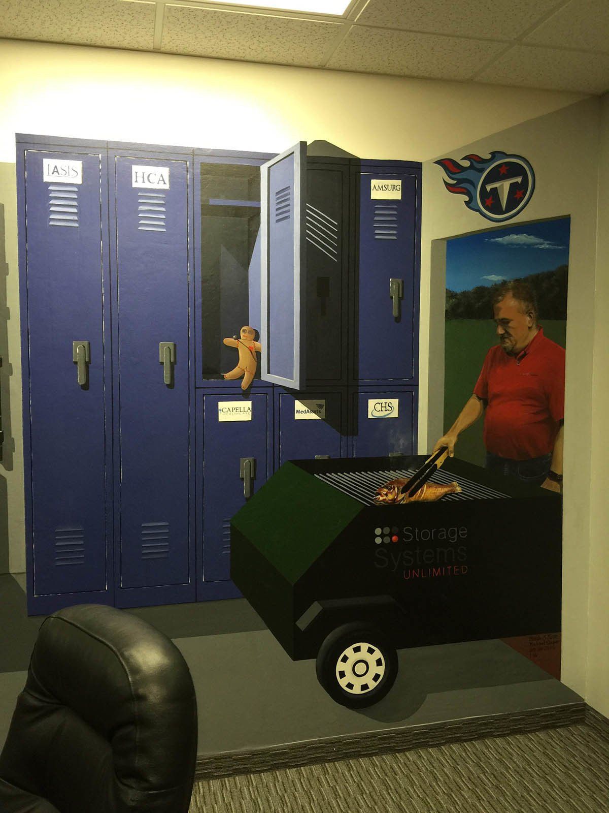 A man is cooking food on a grill in front of lockers