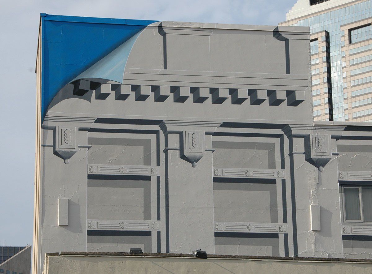 A building with a blue sticker on it that says ' lll '
