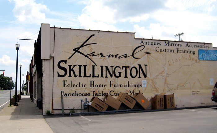 A sign on the side of a building that says skillington