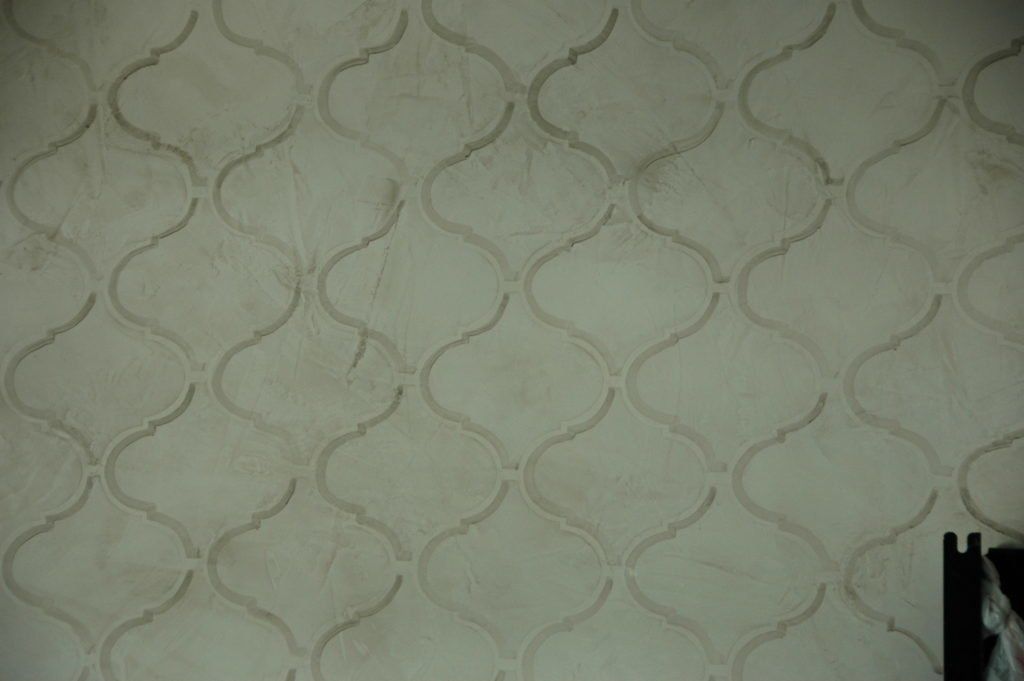 A close up of a wall with a pattern on it.