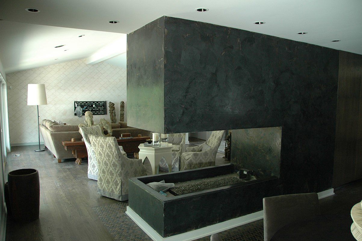 A living room filled with furniture and a fireplace