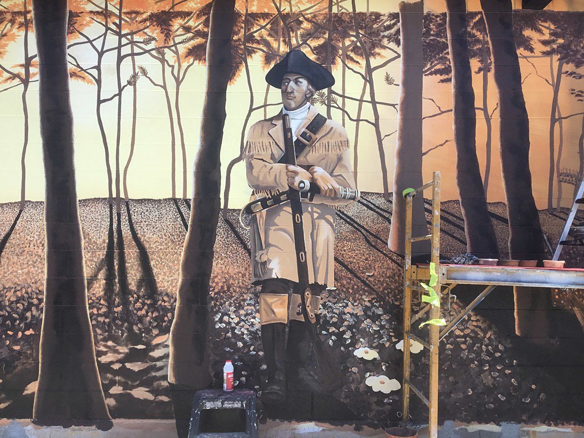 A painting of a man in a military uniform in the woods