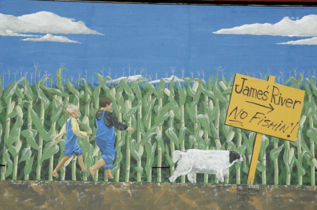 A painting of two children running through a corn field with a sign that says james river no fishing
