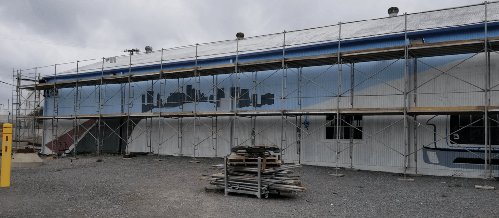 A large building under construction with scaffolding around it