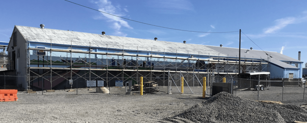 A large building is being built with scaffolding around it.