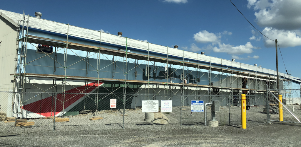 A large building is being built with scaffolding around it.