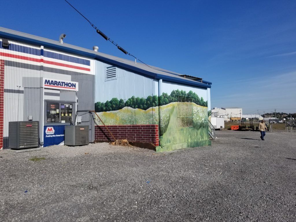 A building with a mural on the side that says marathon