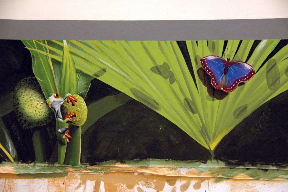 A painting of a frog and a butterfly on a leaf