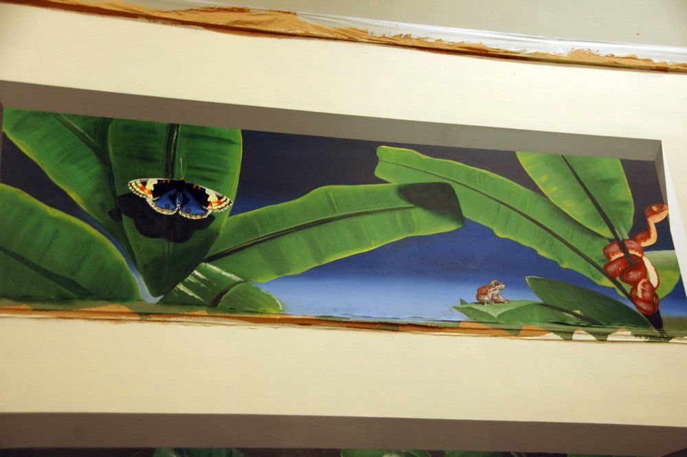 A painting of a butterfly on a banana leaf
