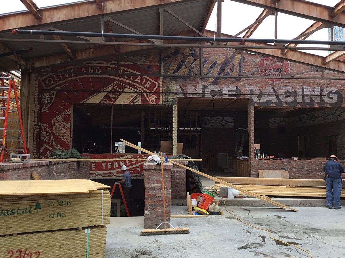A building under construction with a sign that says racing
