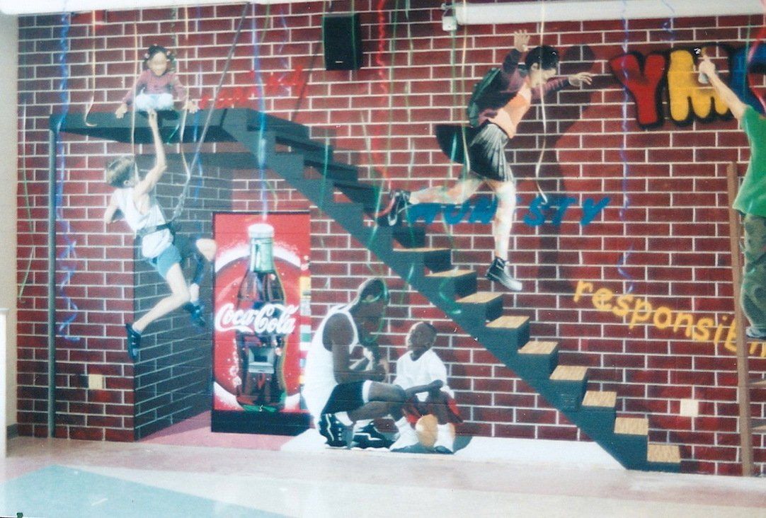 A brick wall with a coca cola advertisement on it