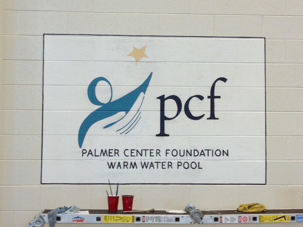Palmer center foundation warm water pool sign on a wall