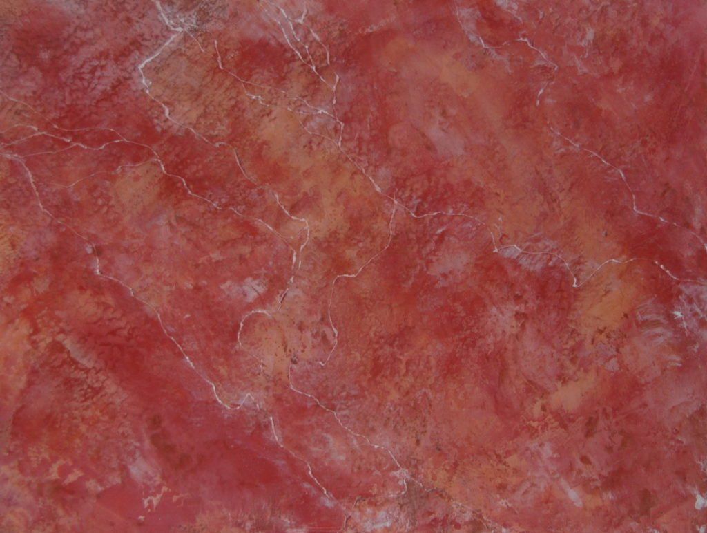 A close up of a red marble texture.