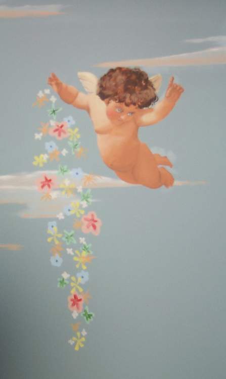 A painting of a cherub flying through the air with flowers coming out of it.