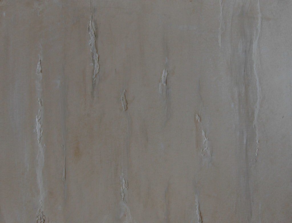 A close up of a piece of wood with a grainy texture.