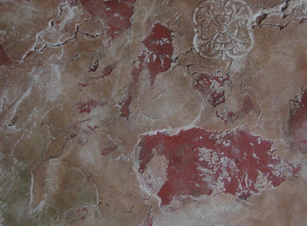 A close up of a wall with a pattern on it