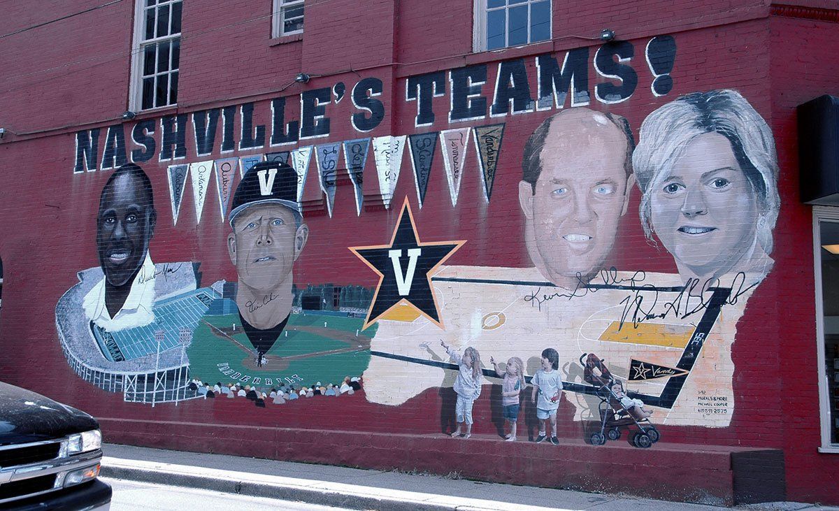 A mural on the side of a building that says nashville 's teams