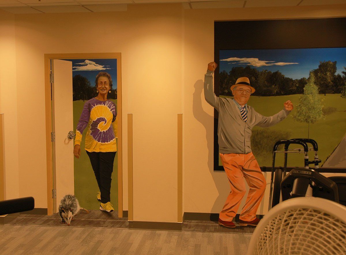 A painting of a man and woman standing next to each other on a wall.