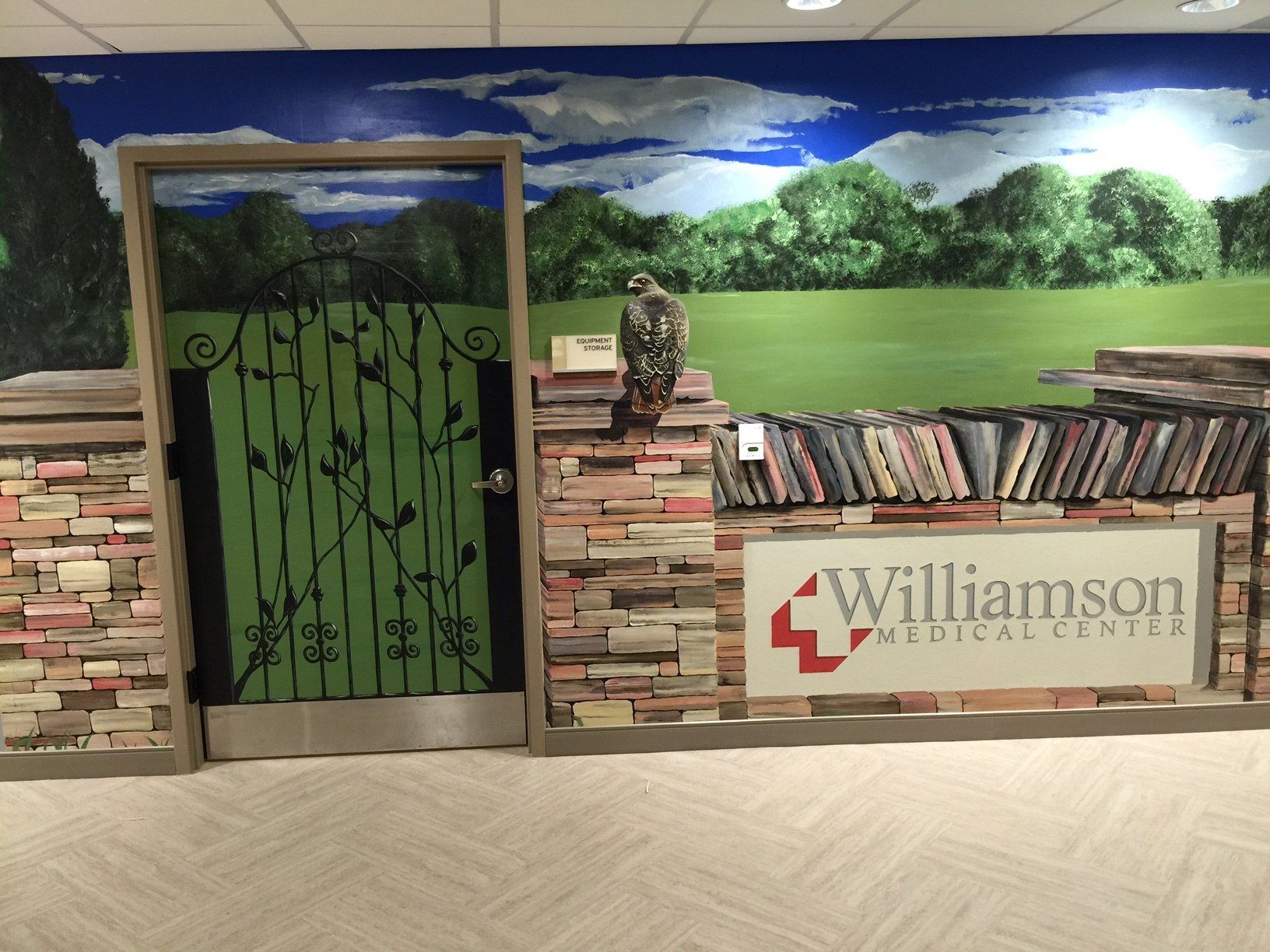 A sign for williamson medical center is above a doorway