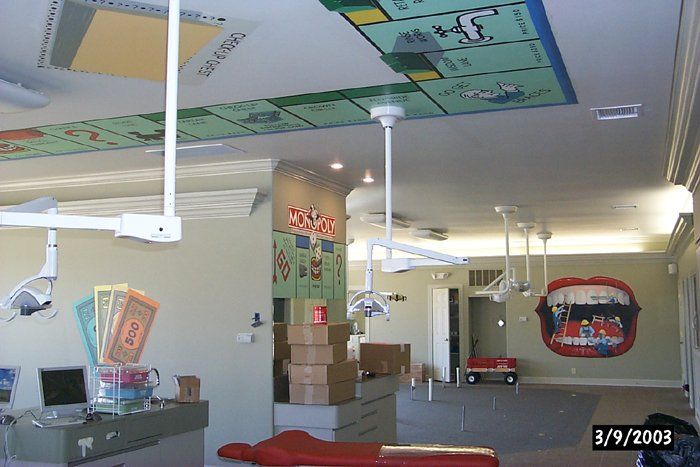 A dental office with a monopoly board on the ceiling