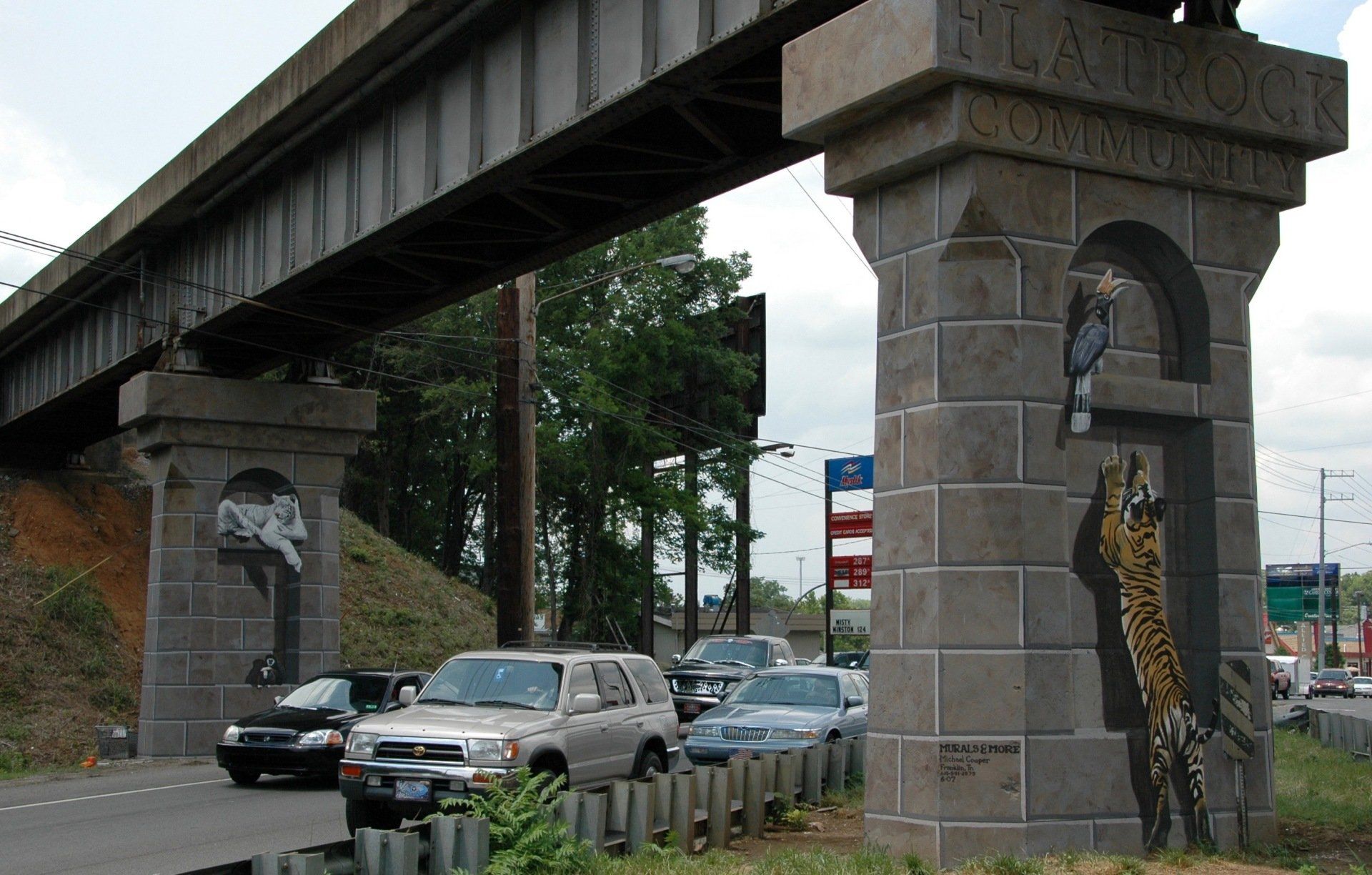 A bridge over a road with a sign that says clarkson